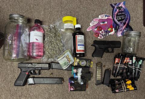 Confiscated during the traffic stop were marijuana, Oxycodone, Promethazine, marijuana vape pens and loaded handguns.