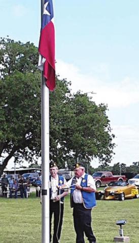 Post 143 members raise flags at Slavnost