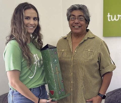 A special garden pole was presented to Turtle Wing Foundation, with Destiny Pescik (left), executive director, accepting the gift from Cindy Villarreal (right), Senior Connections executive director.