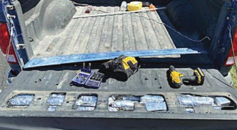 The meth and cocaine were concealed in a compartment in the tailgate of a Dodge pickup.