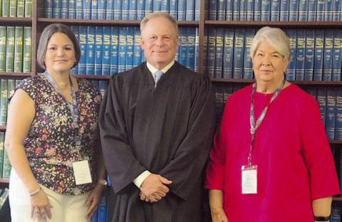 CASA of Bastrop, Fayette & Lee Counties welcomed two new volunteers when Tiffany Miller (left) and Nancy Walters (right) were sworn in by Benton Eskew (center), county court at law judge in Bastrop County