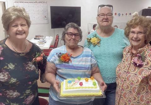 Birth days of th e Mo nth for September were celebrated by (from left) Judy Klesel, Carolyn Moore holding the cake, Betty Gabler and Jannette Hoelscher.
