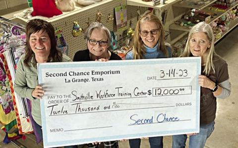 A $12,000 ch eck was presented by Second Chance Emporium to the Smithville Workforce Training Center for classes and training in Fayette County. Shown are (from left) Steph Smith, SWTC sustainability and county program director; Marjess Tovar, RN, county coordinator for Fayette County; Janice Bruno, county coordinator for Fayette County; and Gayle Schielack, Second Chance Emporium store director.