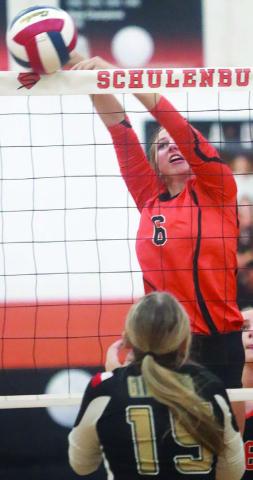 Clara Magliolo taps down a Lady Buffalo over-pass in the third set. Sticker Photo By Darrell Vyvjala