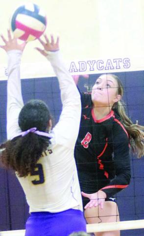 Greenli Van Zandt bangs an attack off a Ladycat block attempt for the 14th point in set five at Weimar. Sticker Photo By Darrell Vyvjala