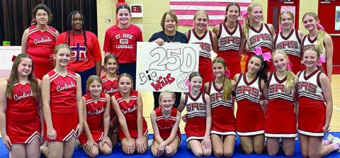 Congratulating coach Sandy Zaruba on reaching the milestone win total of 250 are: (front, from left) Annaston Kutac, Cate Hooper, Briley Stoever, Brielle Goedrich, Kinsley Zapalac, Brillen Hartensteiner, Rylee Wright, Clare Besetzny, Ellia Wotipka, Brynn Bubela, Caroline Bartek; (back, from left) Raven Demel, Jade Williams, CC Schmidt, coach Sandy Zaruba, Tenley Zbranek, Courtney Magliolo, Saybra Pinney, Reese Dusek, and Mallory Bonner.