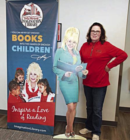 Fayette Electric Cooperative marketing and training manager Tracy Denton poses next to “Dolly,” who travels around Fayette and surrounding counties to spread the word about FEC’s partnership with the Dolly Parton Imagination Library.