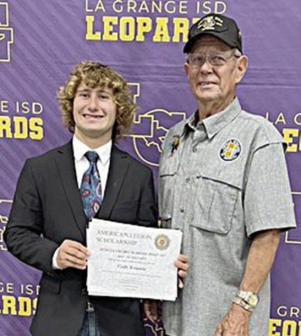 Cody Krupala (left), a La Grange High academic excellence awards recipient, was recently awarded a $1,000 scholarship from American Legion Post 143 in Schulenburg. Cody’s grandfather, Legion Post 143 member Eugene Krupala (right), made the presentation on Thursday, May 9 at the La Grange High scholarship recognition program. Cody will attend A&amp;M University at Kingsville and major in range and wildlife management.