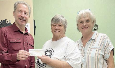 The descendants of the Peter Sommer family have donated $1,081.64 to the Schulenburg Area Food Pantry. Shown are Violet Sommer Hollas (center), granddaughter, Debra Blansitt (right), great-granddaughter, and Ed Semler (left), Food Pantry board member.