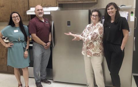 A new freezer was donated to Senior Connections by Wellsential nursing facility in Halletsville. Shown with the freezer are (from left) Erica Furnace and Anthony Villanueva, representing Wellsential; Stephanie Shroyer, Senior Connections program director; and Amanda Kridel, Senior Connections executive director.
