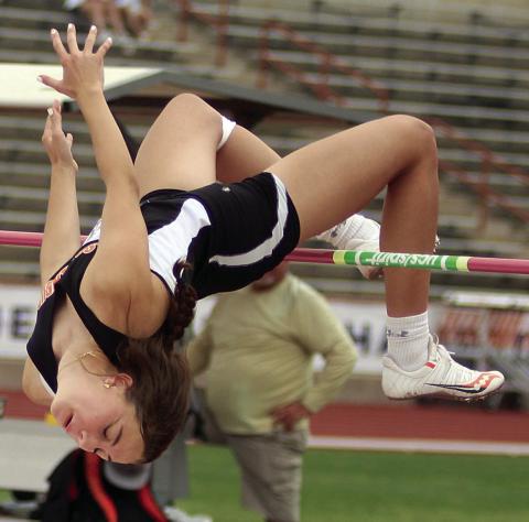 WINNING LEAP – Meredith Magliolo clears 5-feet, 5-inches on her second attempt Friday morning during the UIL’s State Track &amp; Field Championships to secure the Class 2A gold medal in the high jump. Sticker Photo By Darrell Vyvjala