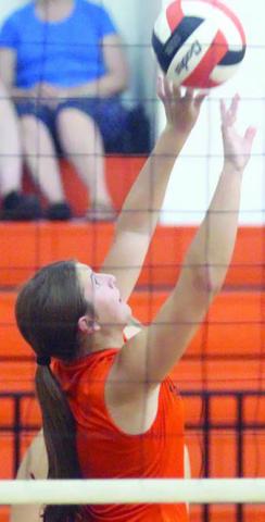 Setter Landry Zapalac tips a ball over in Friday’s scrimmage against Hallettsville. Sticker Photo By Darrell Vyvjala