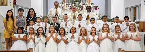 Students receive First Holy Communion at St. Rose Parish