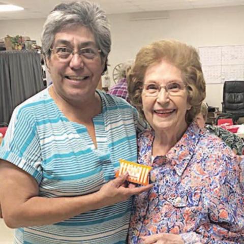 BLACKOUT WINNER – Jeanette Hoelscher (right) of Weimar, won at blackout bingo on Wednesday, Oct. 6. NVCC executive director Cindy Villarreal (left) is also shown.