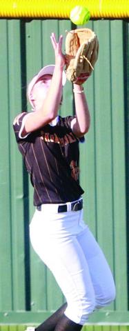 Centerfielder Miranda Bonner tracks down a Lady Comanche fly ball. Sticker Photo By Darrell Vyvjala