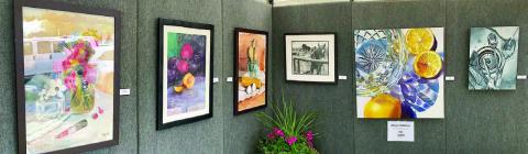 Top photo – A booth with artwork by Allyson Hoffman. 