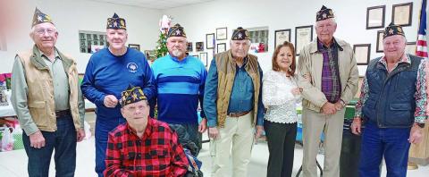 LEGION SERVICE AWARDS – (from left) Harvey Oeding, 15 years; C.W. Leonard, 10 years; in wheelchair, Terry Brown, 50 years; Jesse Lednicky, 5 years; Ben Cerny, 5 years; Renee Hranicky, 5 years; and Henry Miksch,15 years. Commander Bob Heinrich (right) is shown congratulating them. Others not shown are Jon Matus and Francis Ripper, 5 yrs.; Philip Davidson, Samuel Gordon and Ed Semler, 10 yrs.; Pete Goedecker, 15 yrs.; Travis Killion, 20 yrs.; Henry Galipp, 45 yrs.; and Oscar Hinkle and Daniel Kutac, 55 yrs.