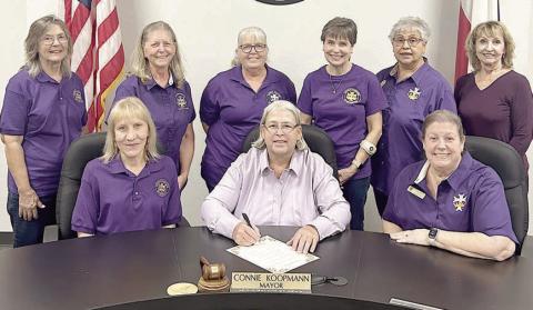 A proclamation for Catholic Daughters Sunday, Oct. 19 has been signed by Mayor Connie Koopmann (front, center). Representing CDA Court St. Rose No. 1597 were (front left) Phyllis Venghaus, vice regent; (front right) Grace Lebeda, regent; (back row, from left) Barbara Veselka and Wanda Doubrava, members; Phyllis Valchar, recording secretary; Peggy Kalich, member; Rosa Galipp, district deputy, Region 11; and Veronica Smith, treasurer.