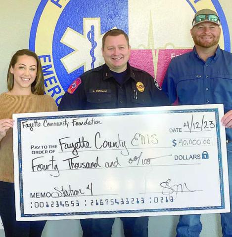 On hand for the $40,000 grant presentation were: (from left) Fayette Community Foundation Executive Director Susannah Mikulin, EMS Director Josh Vandever, and Precinct 4 Commissioner Drew Brossmann.