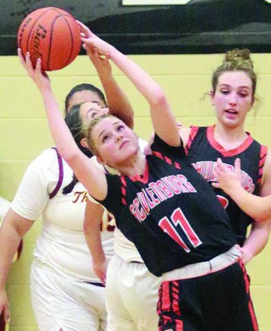 Alana Herzik intercepts a pass in the second half. Sticker Photo By Darrell Vyvjala