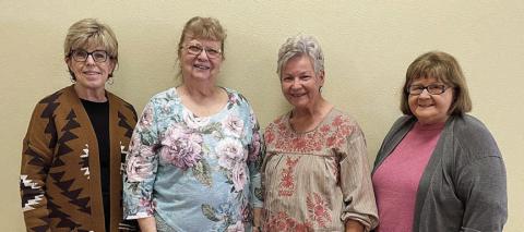The Fayette County Extension Education Association was represented at the District 11 Spring Conference by (from left) Sally Garrett-Fayette County Extension agent for family and community health, Janice Alexander, Lila Garlin and Helen Wagner.