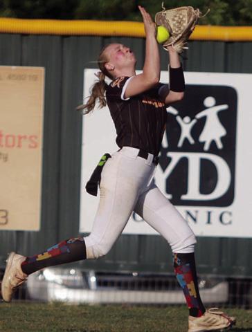 Angel Davis makes a running catch in right-centerfield against Flatonia. Sticker Photo By Darrell Vyvjala 