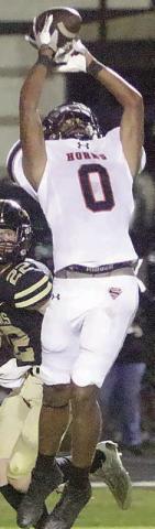 Byron Johnson makes a leaping catch for a 38-yard score.  Sticker Photo By Layne Vyvjala 