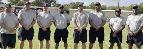 Shorthorn coaches From left: defensive coordinator Isaiah Barrera, Marty Bigham, Jordan Hafley, offensive coordinator Brandon Williams, head coach Luke Hobbs, David Wayne Houston, Jaylen Samuels, and special teams coordinator Gilbert Price. Sticker Photo By Darrell Vyvjala
