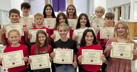 Displaying their certificat es as winners in the annual CDA Education Contest, which included poetry, art, essay, photography and computer art categories, are St. Rose students (front row, from left) Avery Hartensteiner, Clare Besetzny, Mallory Bonner, Ellia Wotipka, Brynlee Berger. (middle row) William Eudy, Weston Hollas, Anna Oeding, Lillia Wotipka, Austin Reeves (back row) Denim Sommer, Josline Campos, Miranda Bonner and Allen Ballard.