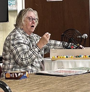Stepping up to call bingo at Senior Connections was Kitra Ruiz (photo at left) and there was a full house to enjoy the games (photo at right).
