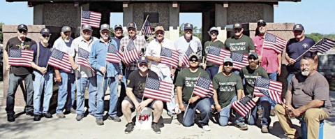 Legion, other groups place flags on veterans’ graves for Memorial Day