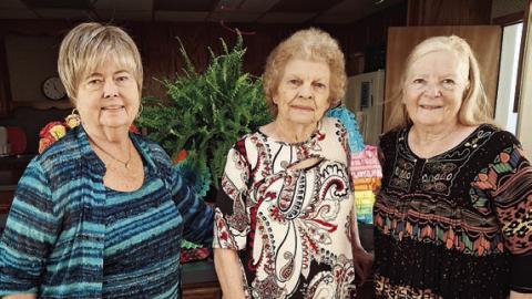 Hostesses were (from left) Bonnie Baker, Jerry Leonard and Janet Murphy.