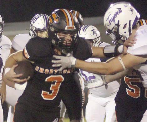 Aaron Janecek finishes off a 7-yard run on the Horns’ first scoring drive. He rushed for 193 yards to bring his regular-season  total to 1,326 yards on 179 carries with 22 touchdowns. In addition, his 131 yards passing against Thrall put him over the century  mark through the air (1,116 yards, completing 89-of-163 attempts  with 11 touchdowns and three interceptions). Sticker Photo By Layne Vyvjala