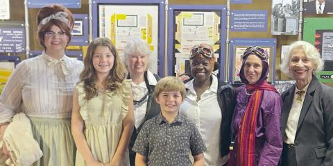 Performing in “Wings of Their Own: Influential Women in Aviation” were (front row, from left) Remi Denham, Tucker Denham, (back row) Kristen Graeter Holub portraying Dorothy Schmidt, Elota Patton portraying Evelyn “Bobbi” Trout, Rebecca Powe portraying Bessie Coleman, Jaci Elliott portraying Harriet Quimby and Janis Richardson portraying Sophie Mühlstein.