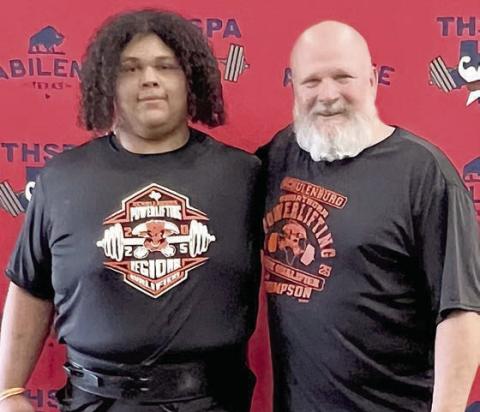 Calvin Thompson (left) poses with SHS powerlifting coach Brad Oden at the THSPA Division 4 state meet.