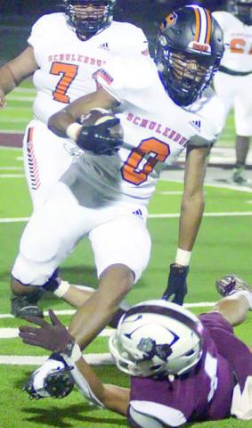 Byron Johnson steps through a tackle to convert on fourth down late in the third quarter. Sticker Photo By Darrell Vyvjala