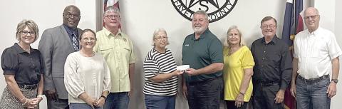 The Schulenburg Economic Development Corporation is pleased to partner with the City of Schulenburg on the installation of new playground equipment at the Sports Complex. Present at the check presentation were (from left) City Administrator Tami Walker, Alderman Greg Thomas, Kim Wellborn representing SEDC, Alderman Frank Wick III, Mayor Connie Koopmann, SEDC president Mark Friedrich, Alderman Kathy Kleiber, Alderman Roger Moellenberndt and Alderman Randy Mican.