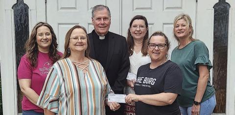 St. Anne’s Society presents donations