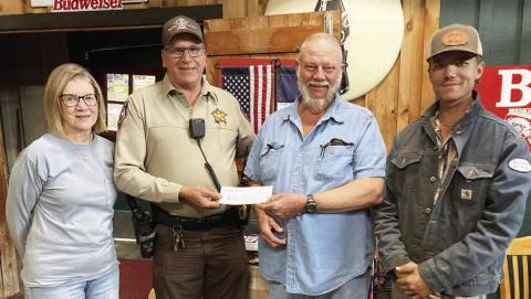 For “Make a Difference Day,” Hermann Sons Schulenburg Lodge 14 presented a monetary gift to the Fayette County Deputy Santa program. Shown are (from left) lodge vice president Mary K. Seifert, Deputy Terry Guentert, lodge president Ed Moeller and member Joshua Roberts.