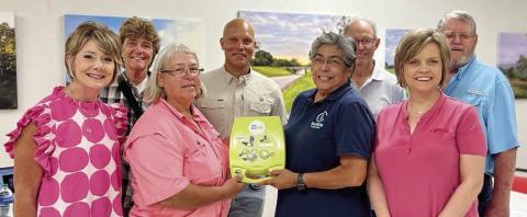 AN Automatic External Defibrillator (AED) was delivered on July 27 in conjunction with the Senior Connections board meeting. Shown at the presentation are (front row, from left) Tami Walker, city administrator; Mayor Connie Koopmann, handing the AED to Cindy Villarreal, Senior Connections executive director; Jennifer Moring of Fayette Savings Bank; (back row) Linda Kobersky; Chip Bubela, board chair; Bob Stanzel, board treasurer; and City Alderman Clarence Ahlschlager.