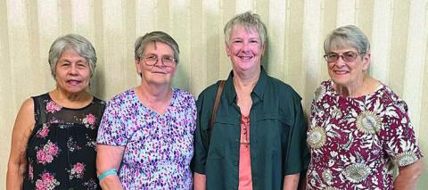 Celebrat ion House Food Pantry in Flat onia representatives acknowledging the donation of hamburger from NVCW are Julia Webster (left), secretary; Evelyn Miller (second from left), director; and Enid Waska (right), assistant director. Representing NVCW is Jackie Harker (second from right).