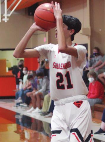 Alex Lozano lines up a three-point field goal in the second quarter against La Grange. Sticker Photo By Darrell Vyvjala