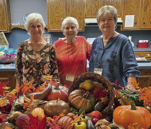 Hostesses were (from left) Delia Jurica, Mary Ann Jurica and Bonnie Baker.