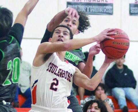 Denver Carr makes an acrobatic move to score in the first quarter. Sticker Photo By Darrell Vyvjala