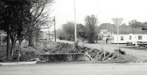 Dr. Leland F. Zatopek took this photograph at the intersection of Jackson Street with Live Oak and Eblin streets in La Grange in 1978 before Beef Head Ditch was covered. Photo Courtesy of Fayette Heritage Museum &amp;Archives, La Grange