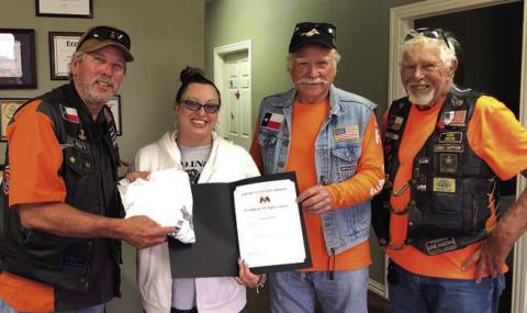 Presentation to Vincent’s Roofing – From left: Gerald Smith, representing the American Legion Riders; Candy Cordova, representing Vincent’s Roofing; and Dallas Canada and Herb Fish, representing the American Legion Riders.