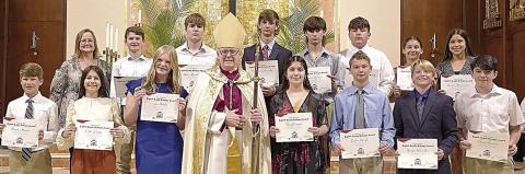 Bishop’s Award recipients FROM ST . ROSE OF LIMA CATHO LIC SCHOO L, shown with the bishop and school principal, were (front row, from left) Brayden Stoever, Lillia Wotipka, Ava Bubela, Bishop Brendan Cahill, Joseline Campos, Caden Herzik, Joseph Schindler, Denim Sommer, (back row) St. Rose principal Rosanne Gallia, Dillon Goedrich, Mason Kunschick, Connor Lichnovsky, Brant Redman, Ian Reeves, Ava Slaton and Morgan Steinhauser.