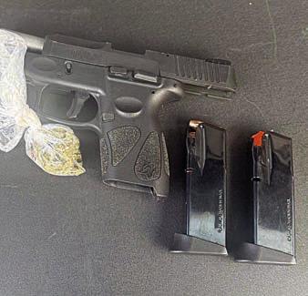 Shown above are the handgun and marijuana found by SPD officers in a vehicle after a traffic stop.