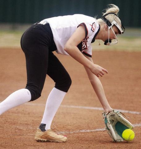After delivering a pitch in the first game of the tournament, Kinley Tillery fields a slow roller for an out. Sticker Photo By Darrell Vyvjala