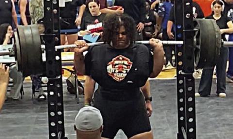 Calvin Thompson steadies himself before a squat attempt at the regional powerlifting meet on Friday in Navasota.